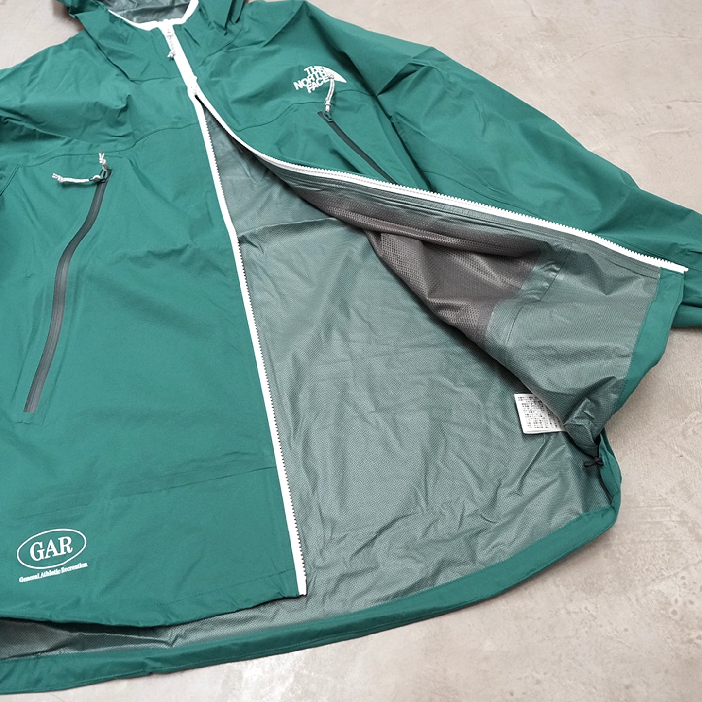 【THE NORTH FACE GAR】ザノースフェイス unisex GAR Light Rain Jacket "TNF Green"