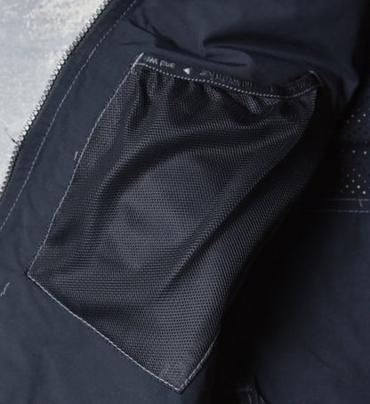 【and wander】アンドワンダー men's laser hole nylon taffeta vest "Charcoal"