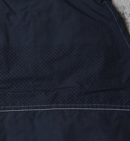 【and wander】アンドワンダー men's laser hole nylon taffeta vest "Charcoal"